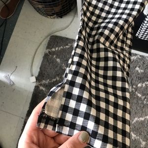 Checkered fitted pants with ankle slits.